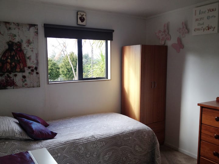 King Single room with work desk and overlooking rural views.