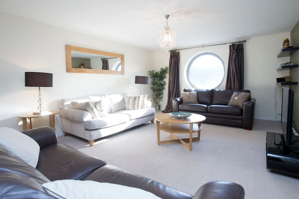 Lovely lounge has view of river, TV, DVD, iPod docking station, loads of seating