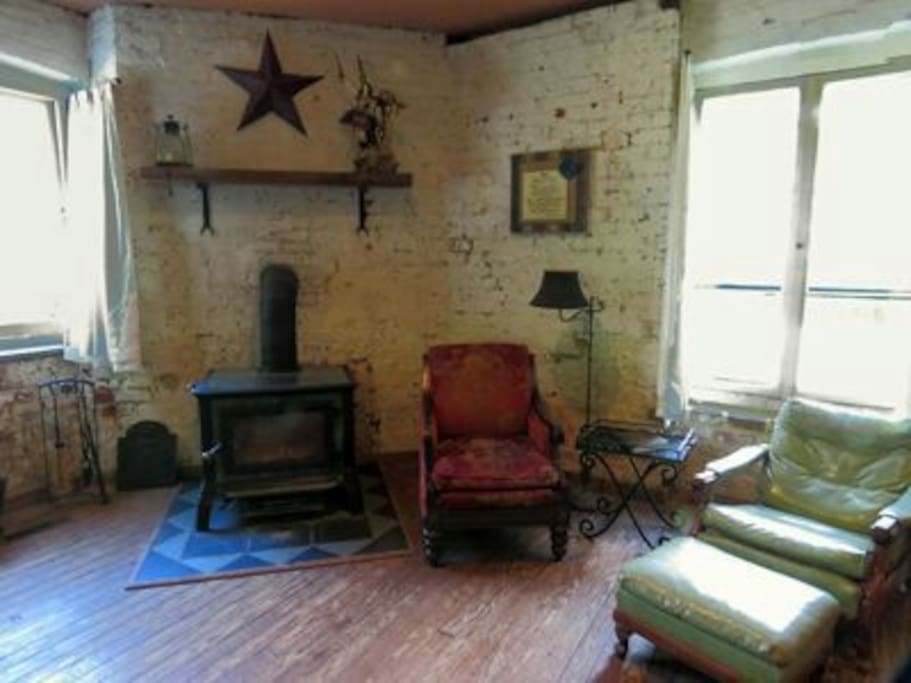 Front sitting area by the woodstove and window to the field and creek.