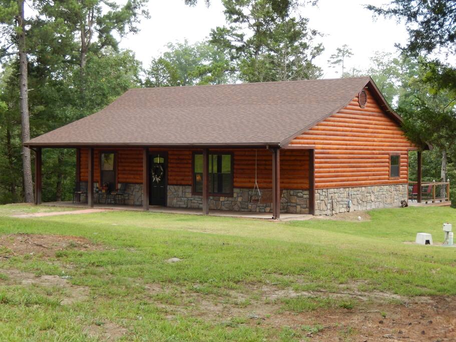 New Log style cabin on heavily wooded 2.8 acre lot.