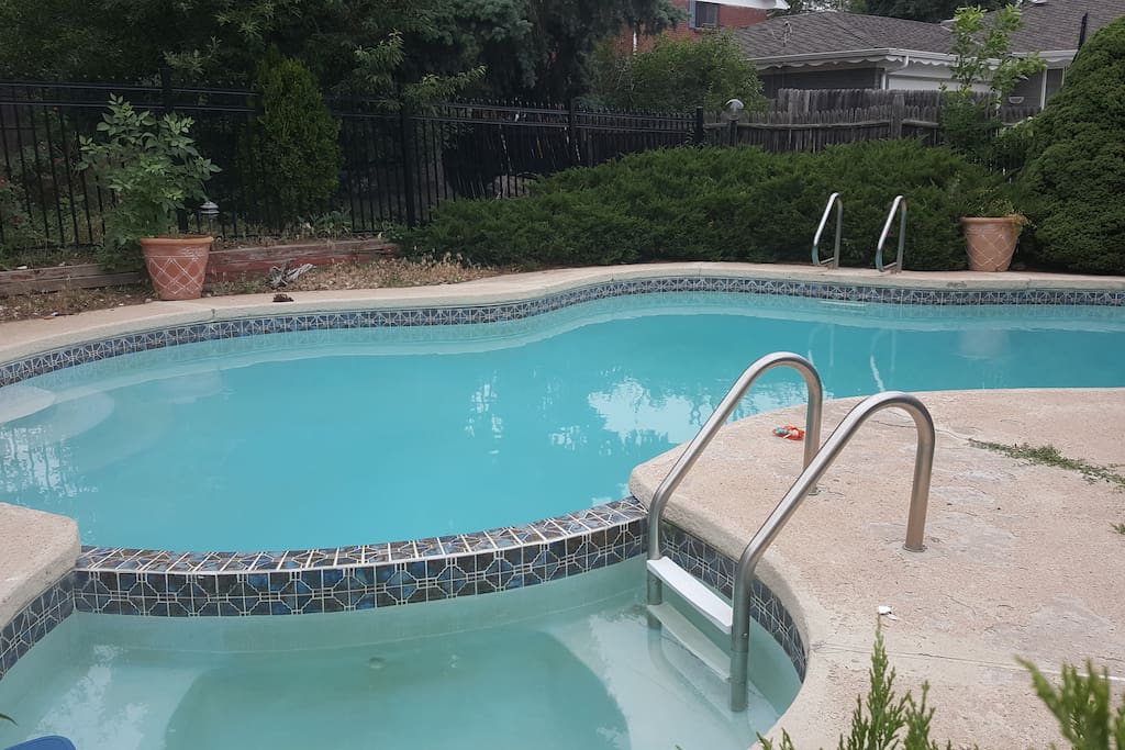 private backyard pool and hot tub