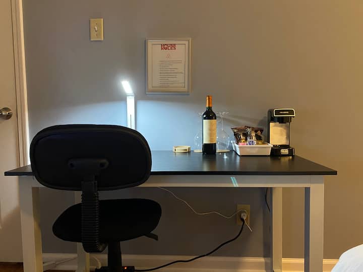 Bedroom #1 (called the Gryffindor room). Within this king size master bedroom, you will find a desk area, King Size bed, a 42' Small Roku TV, personal coffee maker, coffee, tea and a complimentary bottle of wine.