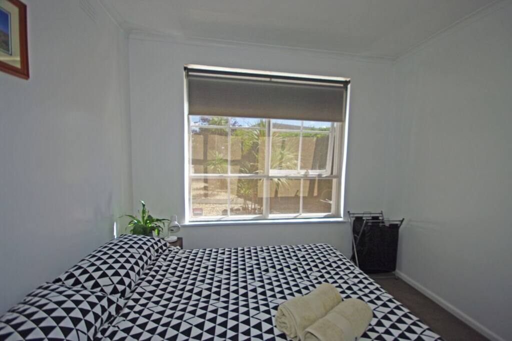 Window with day and night blinds... View of the shared courtyard in my block.