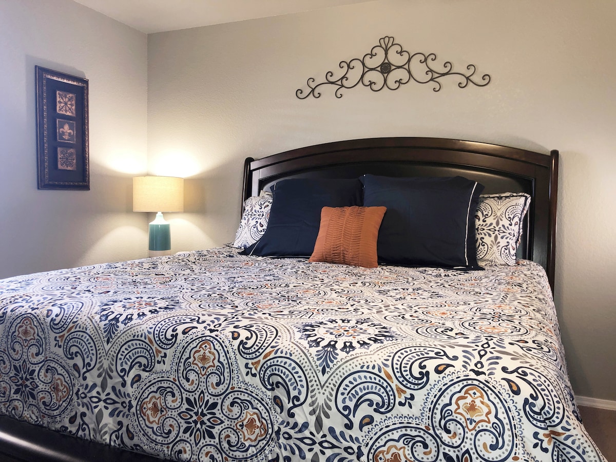 The spacious King Suite has a ceiling fan and a 14" memory foam king size mattress, night stand, alarm clock and lamp.