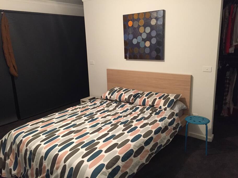 master bedroom with large walk in robe