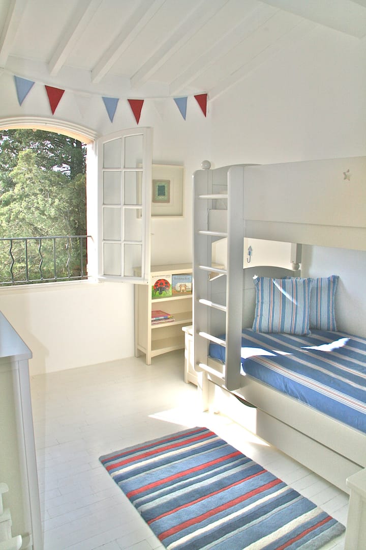 Bedroom 2 for children or teenagers. The room has adult sized bunk beds. It is next to Bedroom 1 on the first floor and shares a family bathroom with a shower and bath. There is a cupboard in the bathroom with equipment for babies and toddlers.