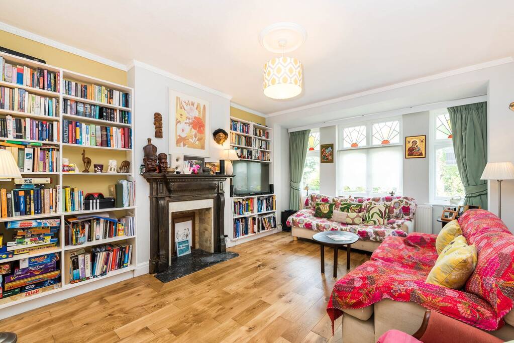 Living Room with flat screen TV, books & games