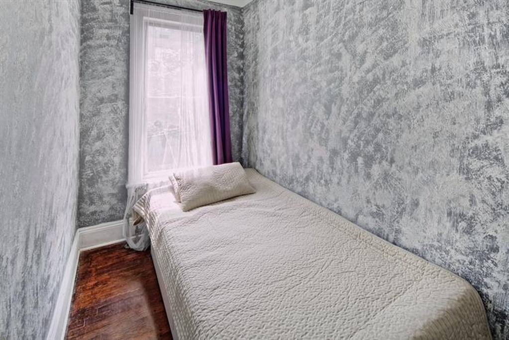 Guest Bedroom. Bed opens out. Black out curtains for the photo sensitive.