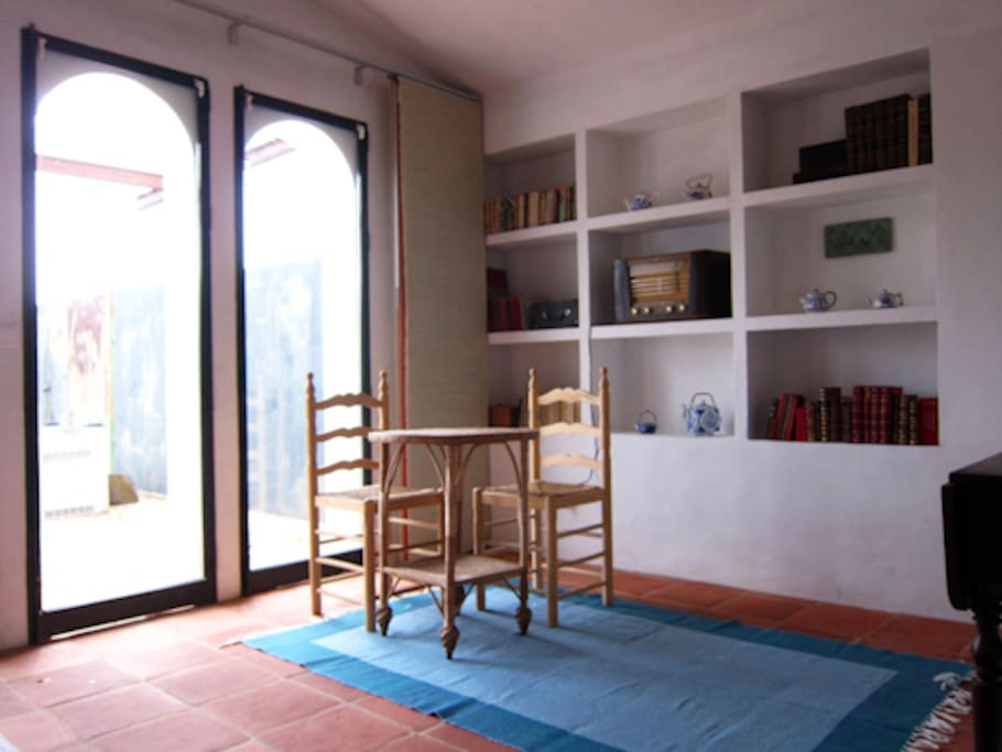 Living room with a lot of light and a eating table