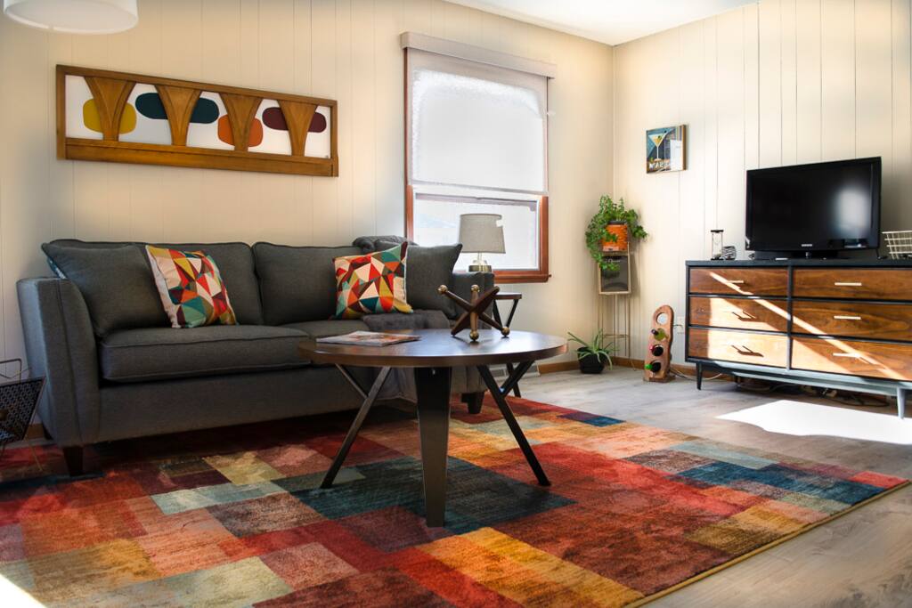 Enjoy the custom artwork and decor in our spacious living room.