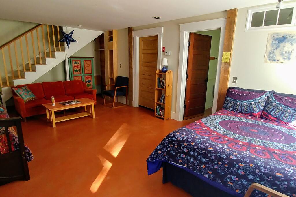 The studio is comfortably furnished with two beds, couch and chairs--and has a concrete floor, which provides radiant floor heat in the cooler months.