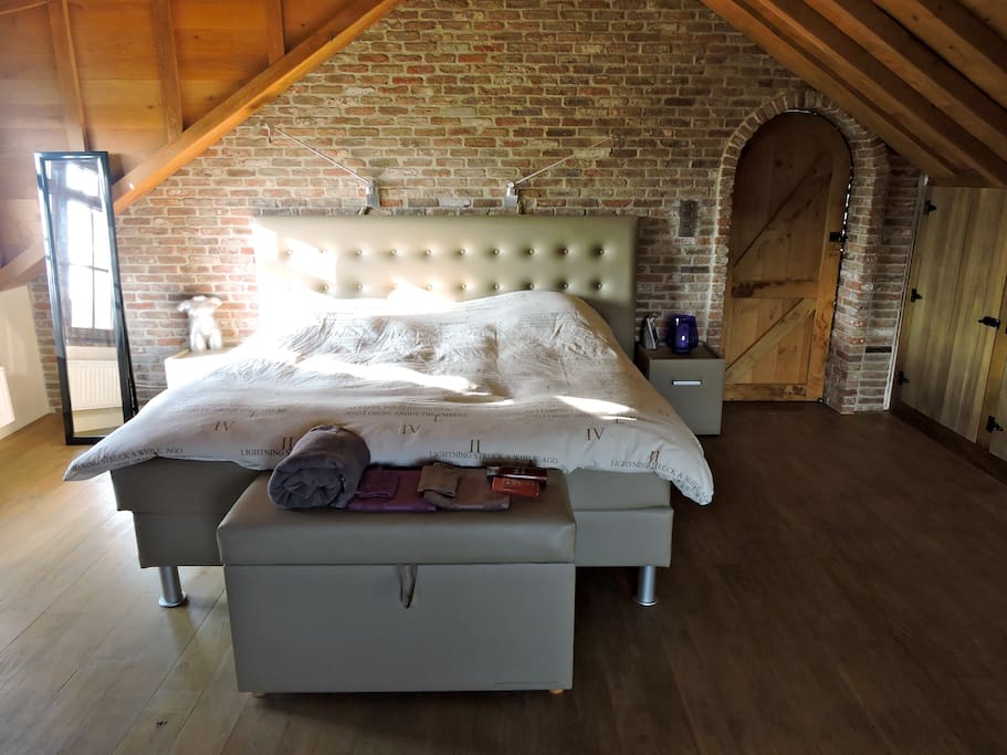 a large bedroom with television
