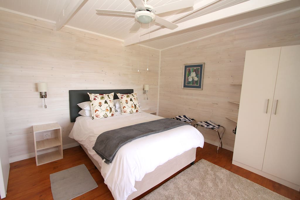 Main bedroom with queen-sized extra length bed