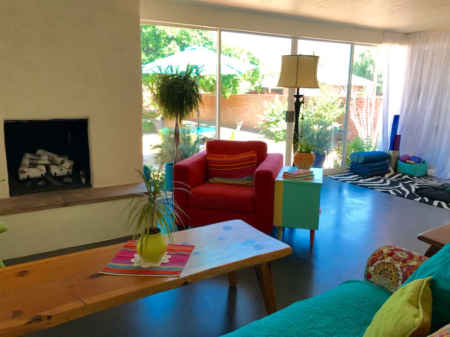 Bright and happy living room which overlooks the lush backyard, pool and Catalina Mountain views.