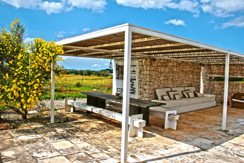 Gazebo with sofa and dinner table