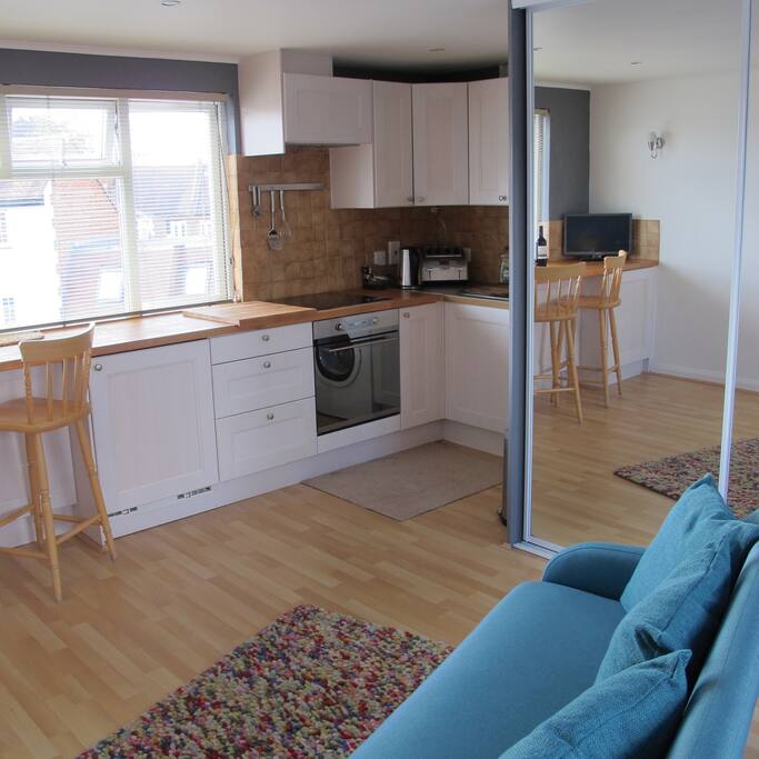 The kitchen, breakfast bar and wardrobe