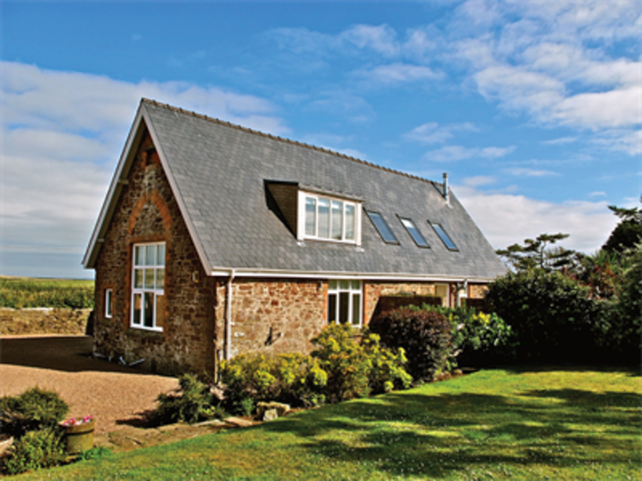 The detached property sits in stunning walled gardens