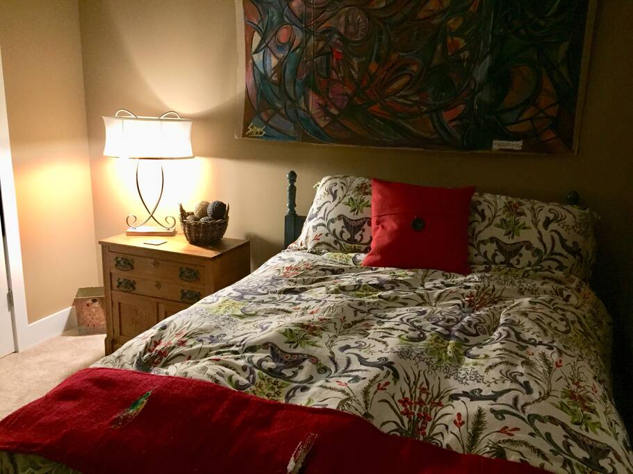 Your bed with cozy duvet and fluffy pillows