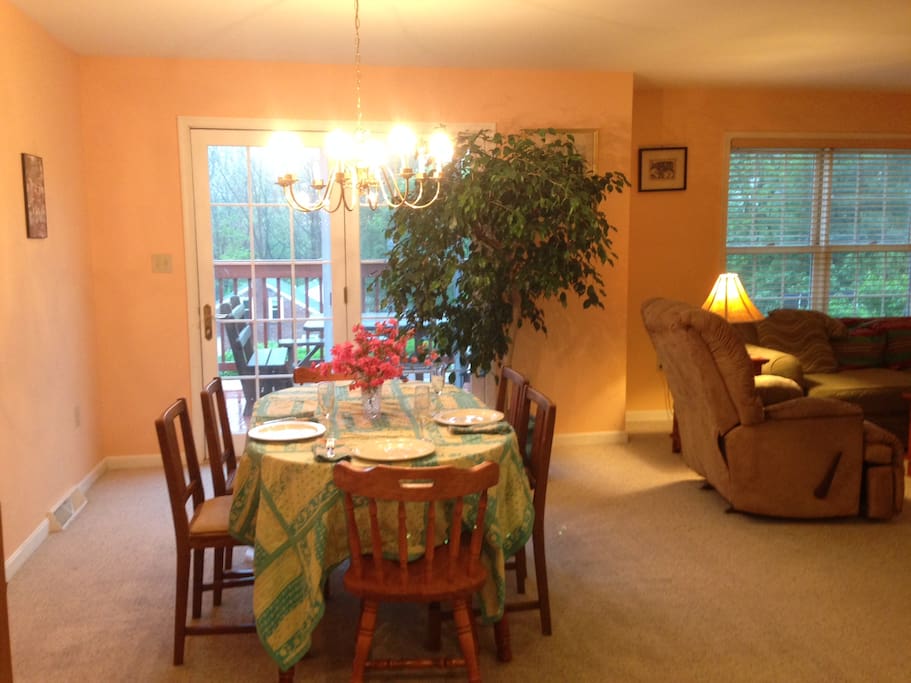 The dining area has exposure to the outside through the french doors.
