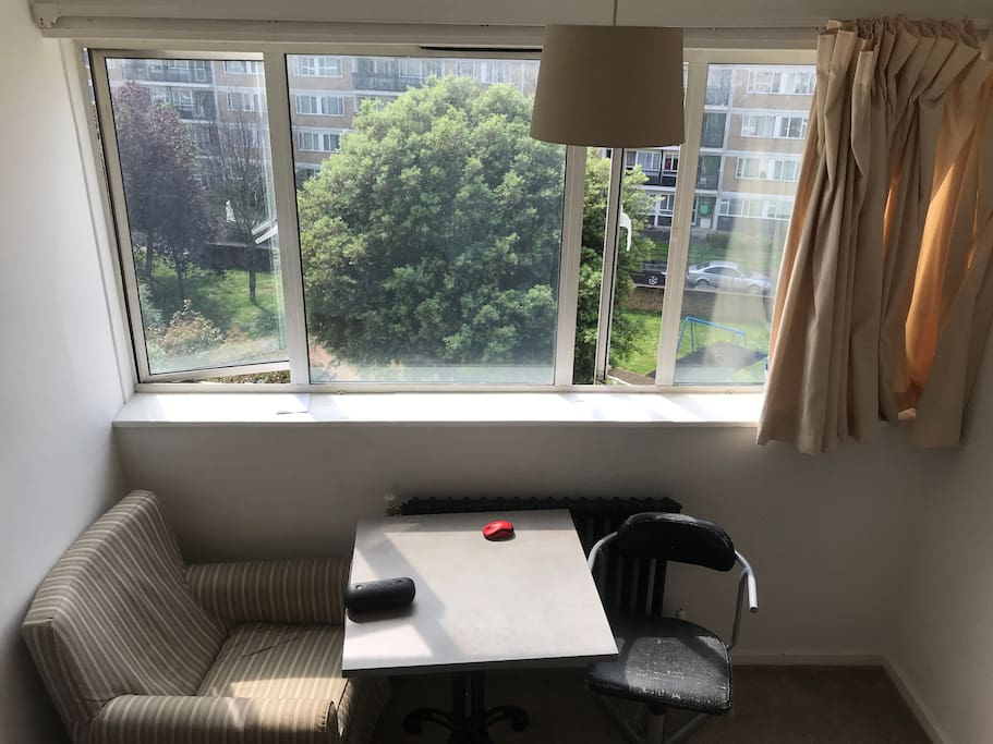 Sofa and chair with table and views