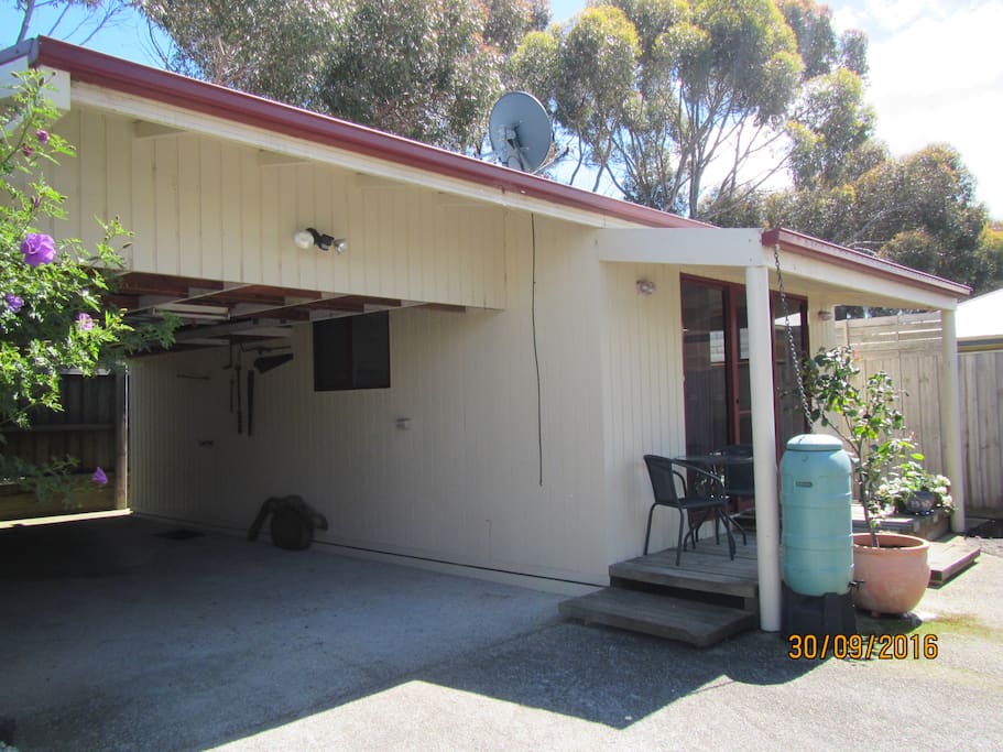 Under cover parking and outdoor shower