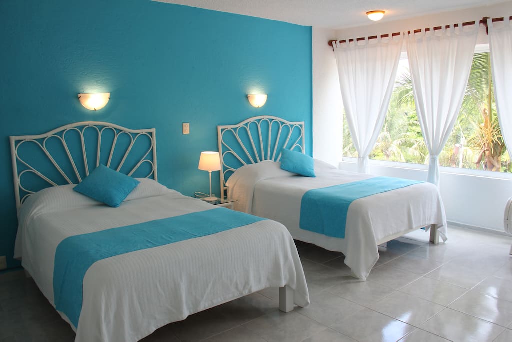 Comfortable Large Bedroom with two queen size beds.