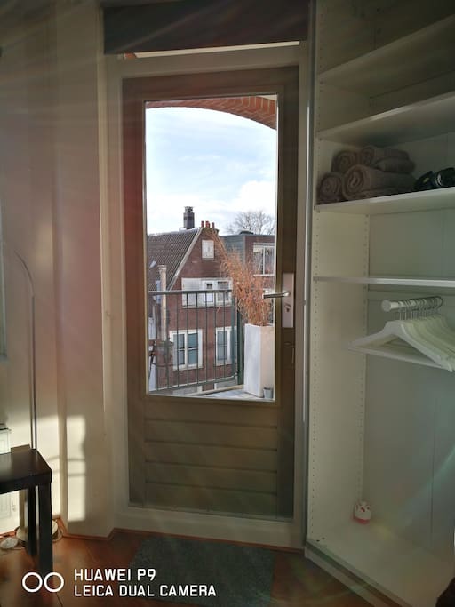 wardrobe and door to balcony