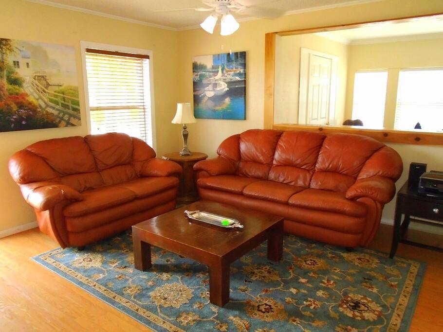 Comfortable Living Room with Great Views of the Trees and City