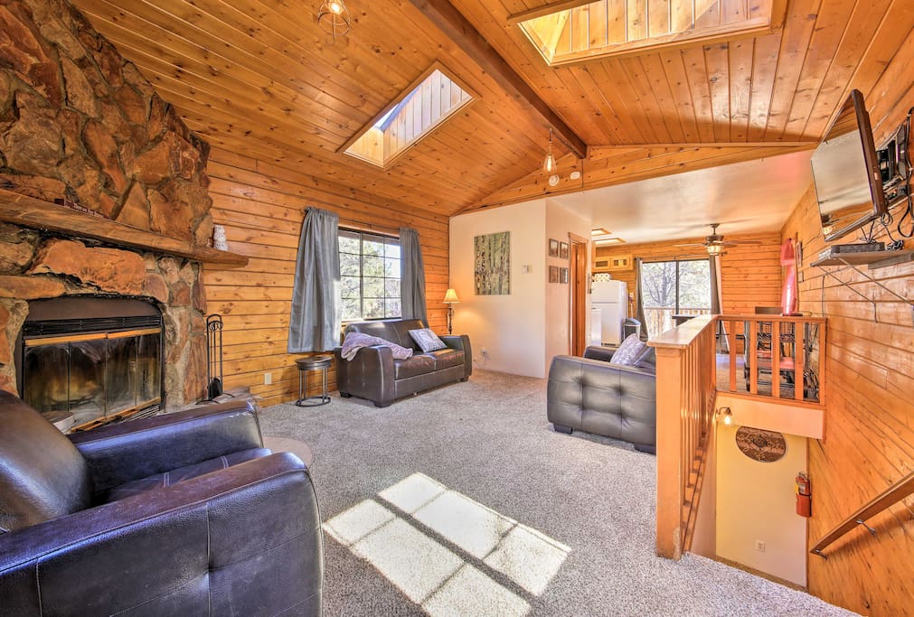 Wood beam ceilings and rustic decor create that classic cabin atmosphere in the living space.