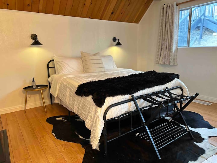Guest bedroom 1 with closet space and electric fireplace. Queen size bed (sleeps 2). 