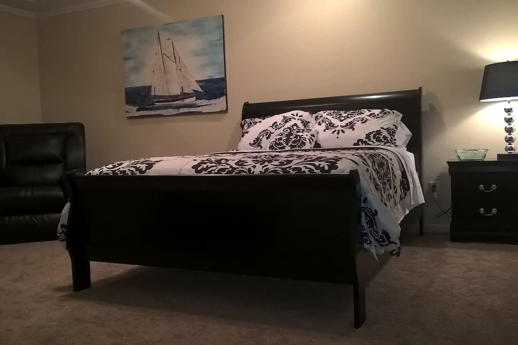 Master Bedroom Suite w power leather recliner, queen pillowtop, linens, nightstand and lamp