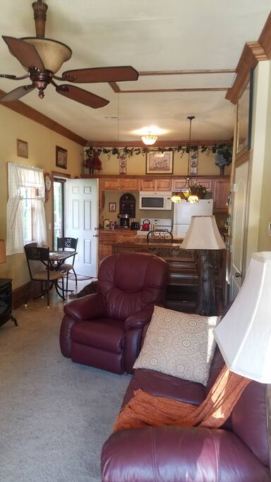 Kitchen and living room are open floor plan, all furnishings and appliances are like new. Tastefully decorated with that Country Charm.