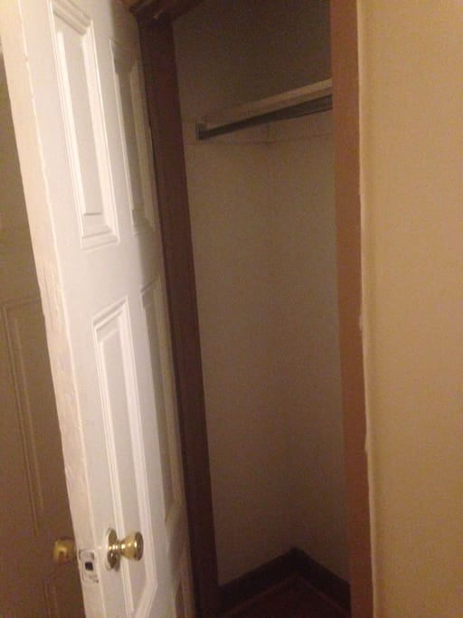 The closet is relatively large it has a shelf and a bar to hang dresses dress pants etc. in their space on the floor to place your shoes if you would like.