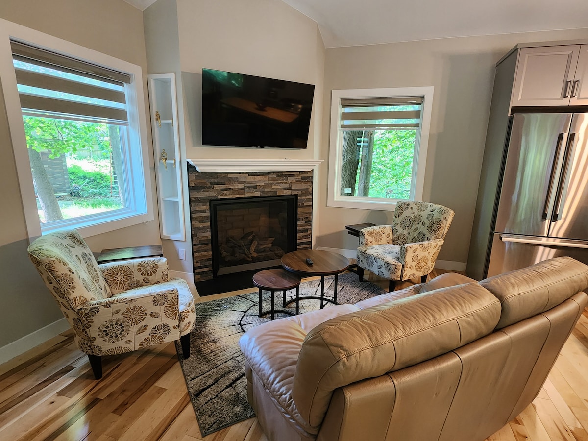 Upper level - living room area with Roku TV and remote-controlled, gas fireplace that can heat the entire home. 