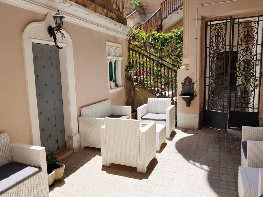 Ancient gate entrance to the terrace of the apartment