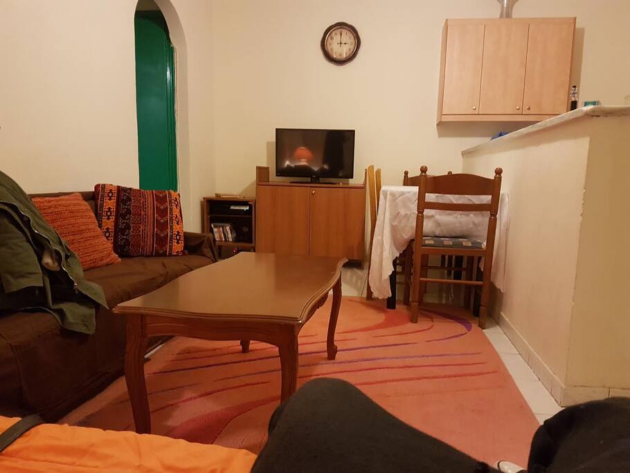 The living room of the apartment is a nice comfortable area to relax and watch TV.