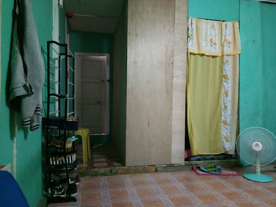 the white bach door is wer the guest can stay..its a room..
beside is the comfort room..
the one with yellow curtain is our room..
she/he can also use shoe racks