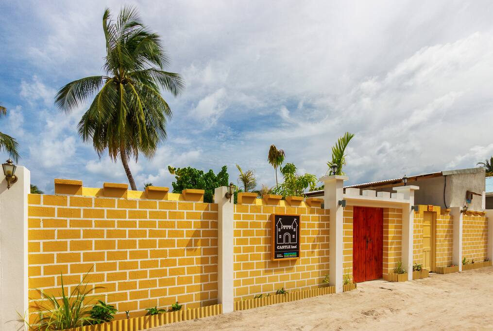 Entrance and high boundary wall providing privacy