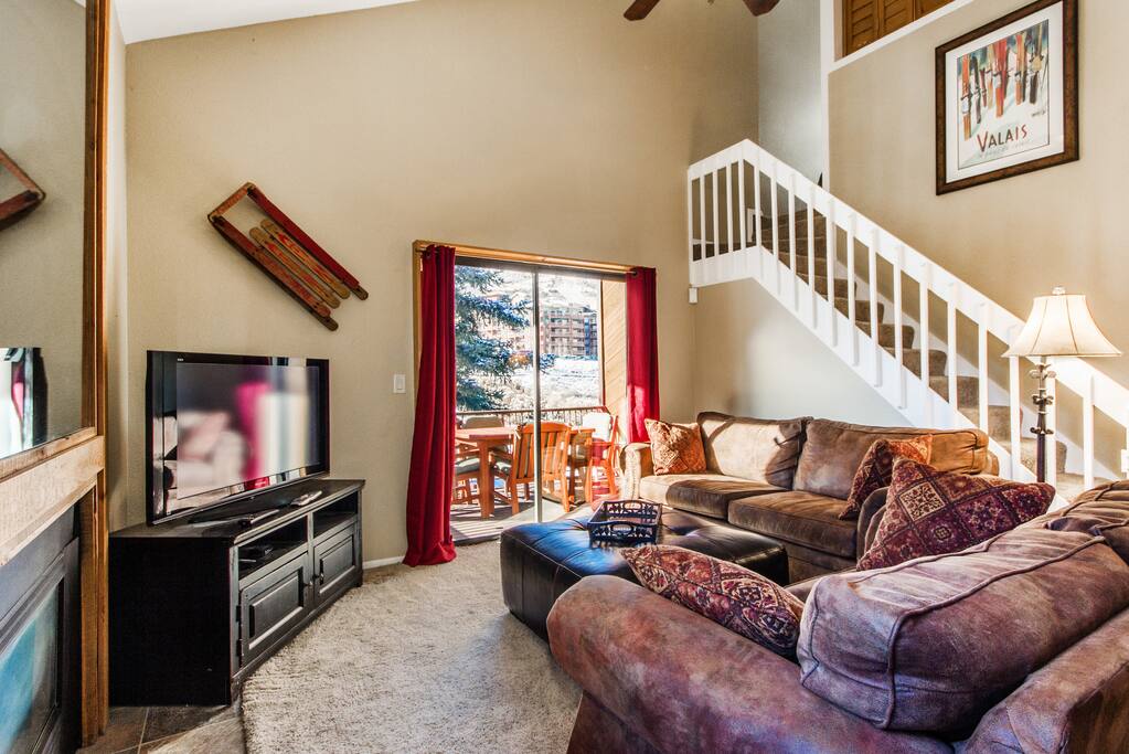 Enjoy the mountain view from inside or outside on the private balcony!