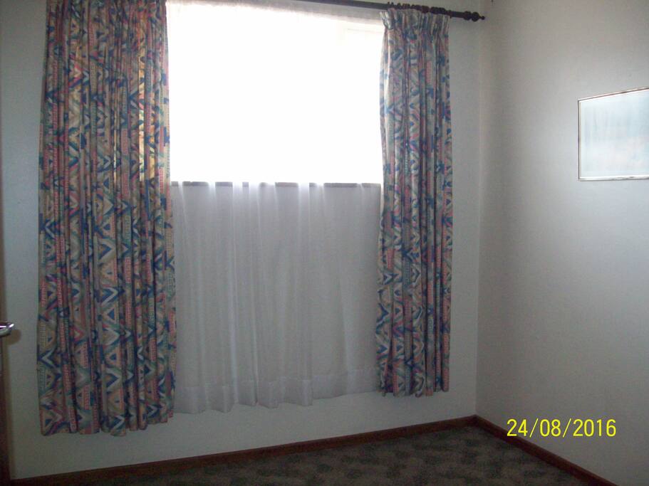 View of the window area in bedroom.