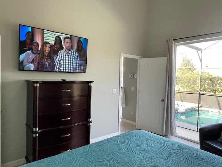 Master Bedroom 1 featuring a Smart TV