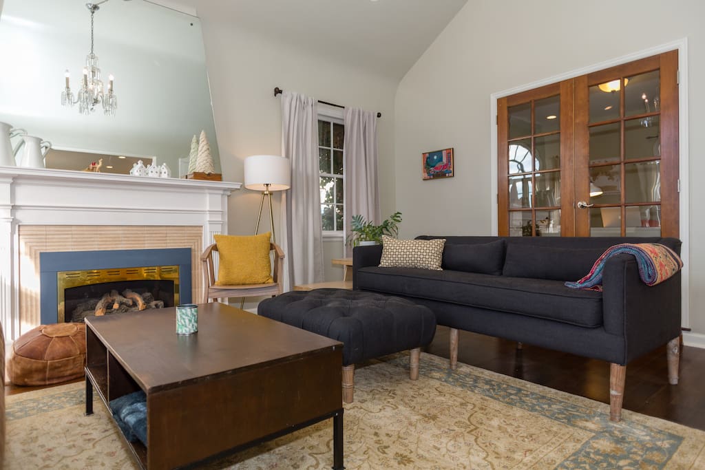 Behind the living room are French doors that lead to an office.