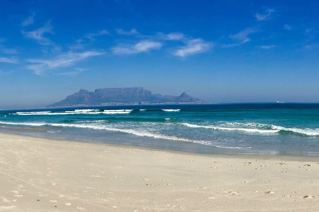 Enjoy a walk on the beach and get the most amazing shots of Table Mountain.