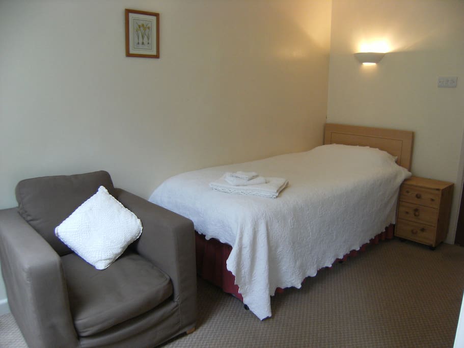 Bed in single guest room
