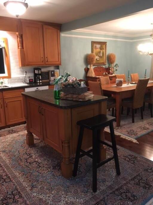 beautiful Persian rugs added to the kitchen and dinning area
