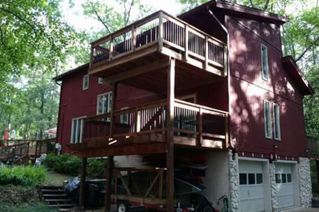 Back of house including upstairs balcony deck.