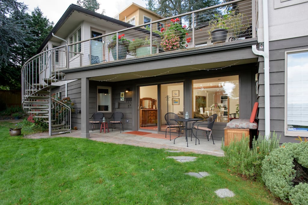 Private entrance to lower level apartment with driveway parking.