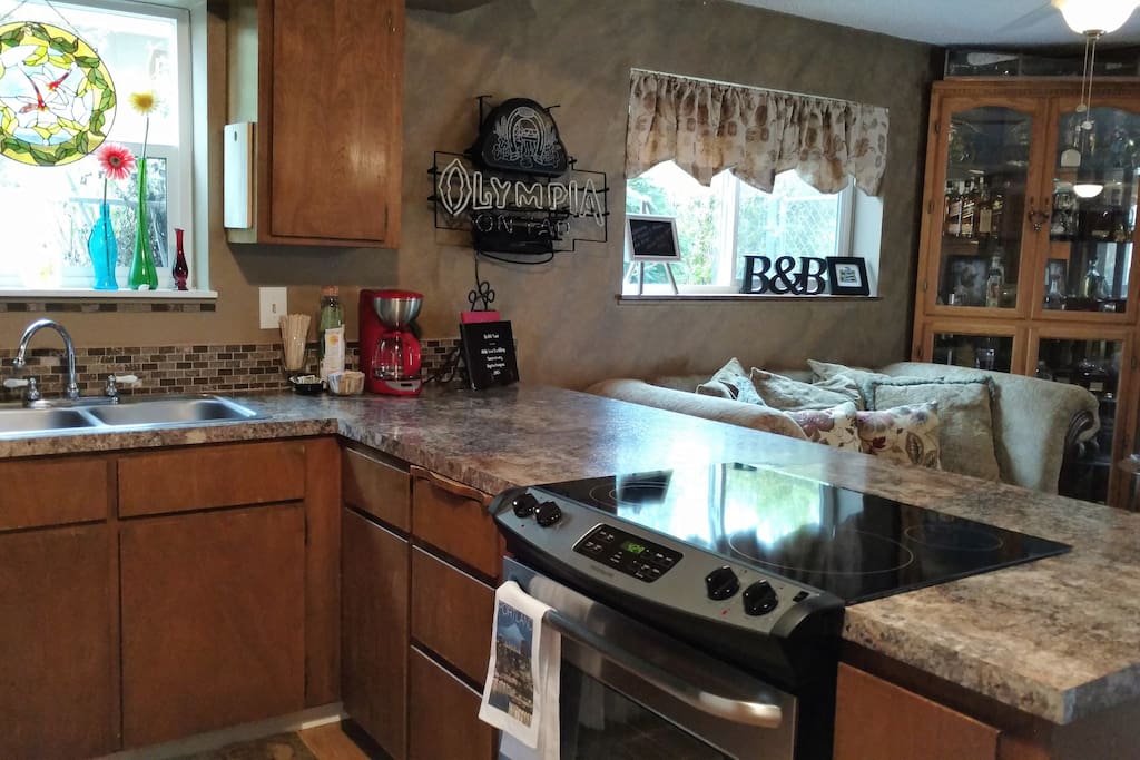 Kitchen, stove, dishwasher, frig , microwave, coffee pot, and double sink, condiments, dishes, pots and pans!