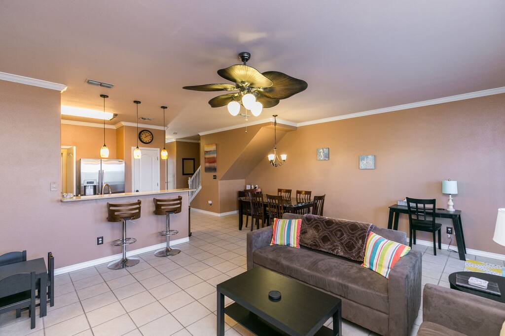 Microfiber couches offer comfortable seating in the living room.