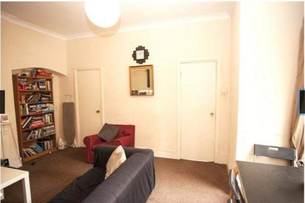 Shared living room with dining table and smart tv with Netflix etc.